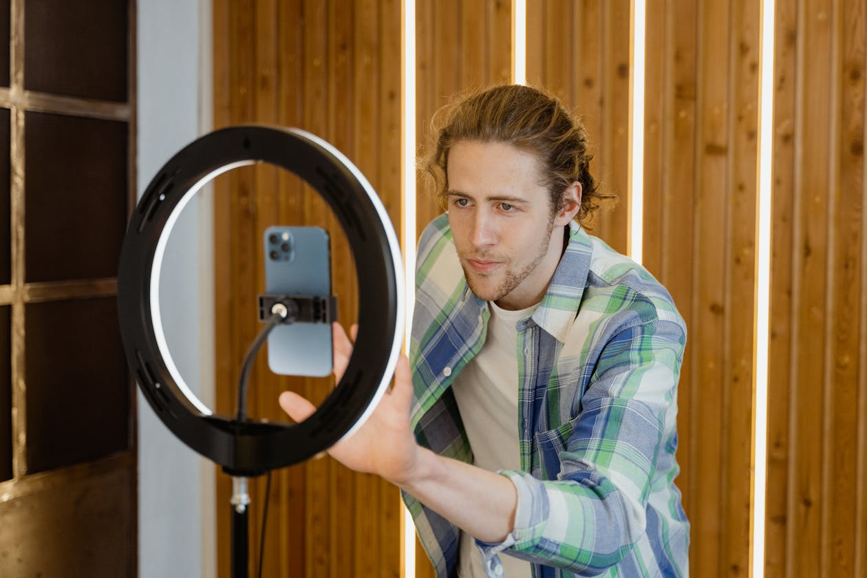 Man setting up his smartphone for filming